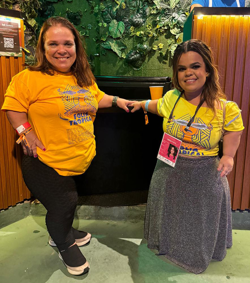 Kenia Rio and Rebeca Costa standing in front of a lowered bar counter at Carnival