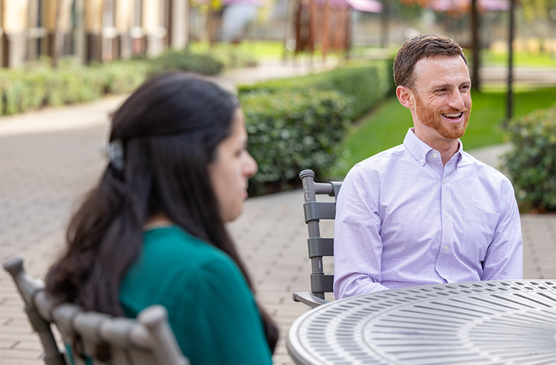 Two BioMarin employees sitting outside.