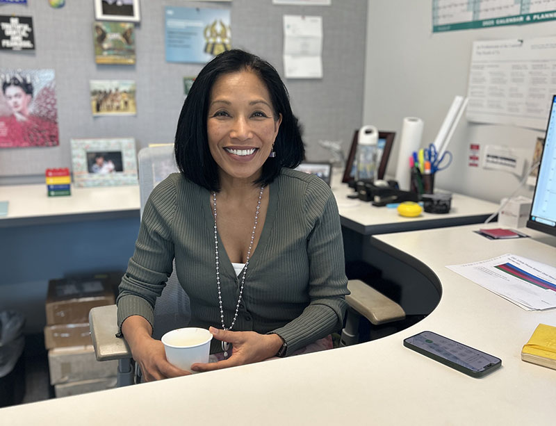 Johanna Lucas sitting at her work desk